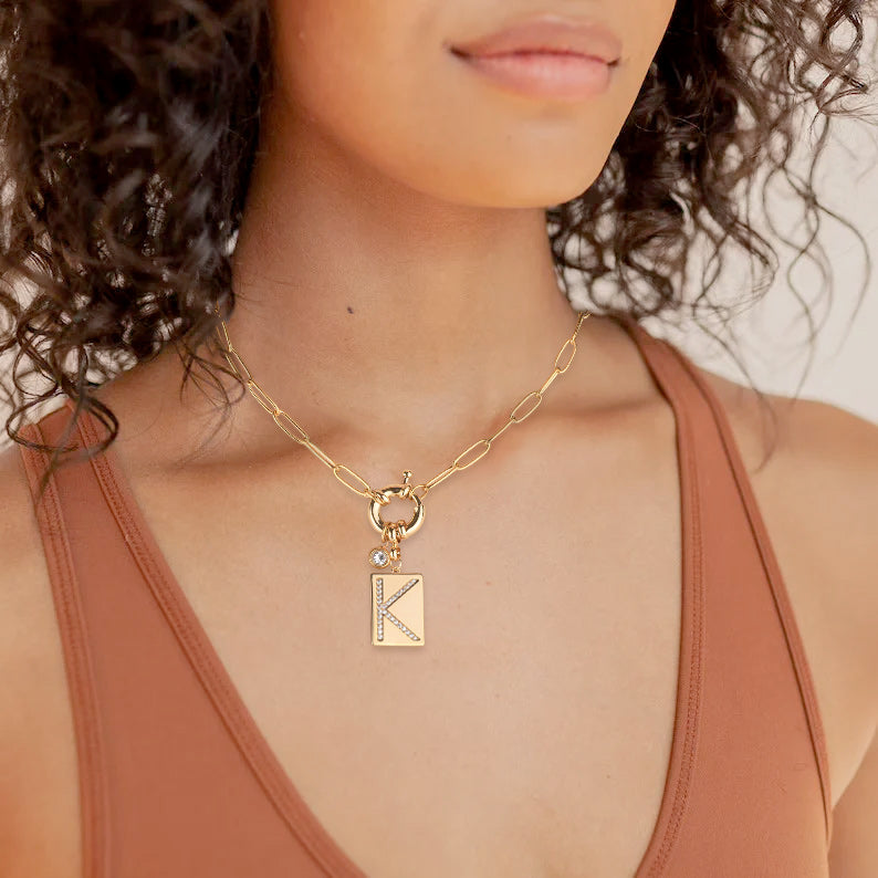 Pavé initial necklace on model