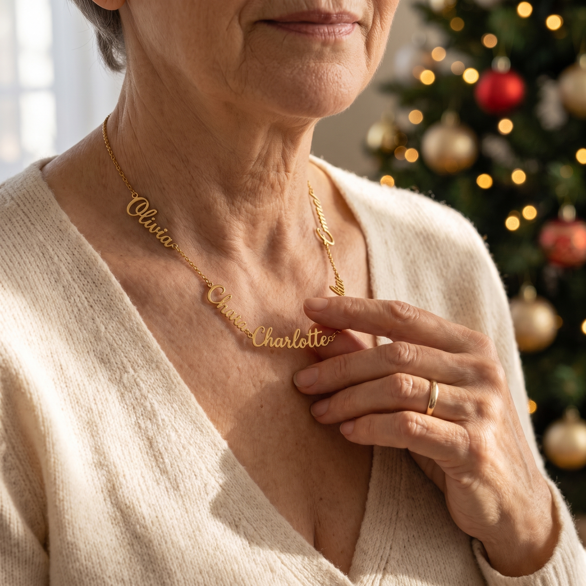 KALYS multi-name necklace worn by a grandmother