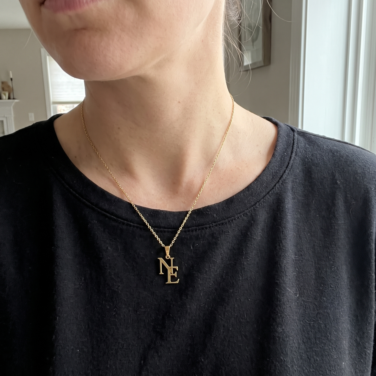 LUVED initials necklace worn