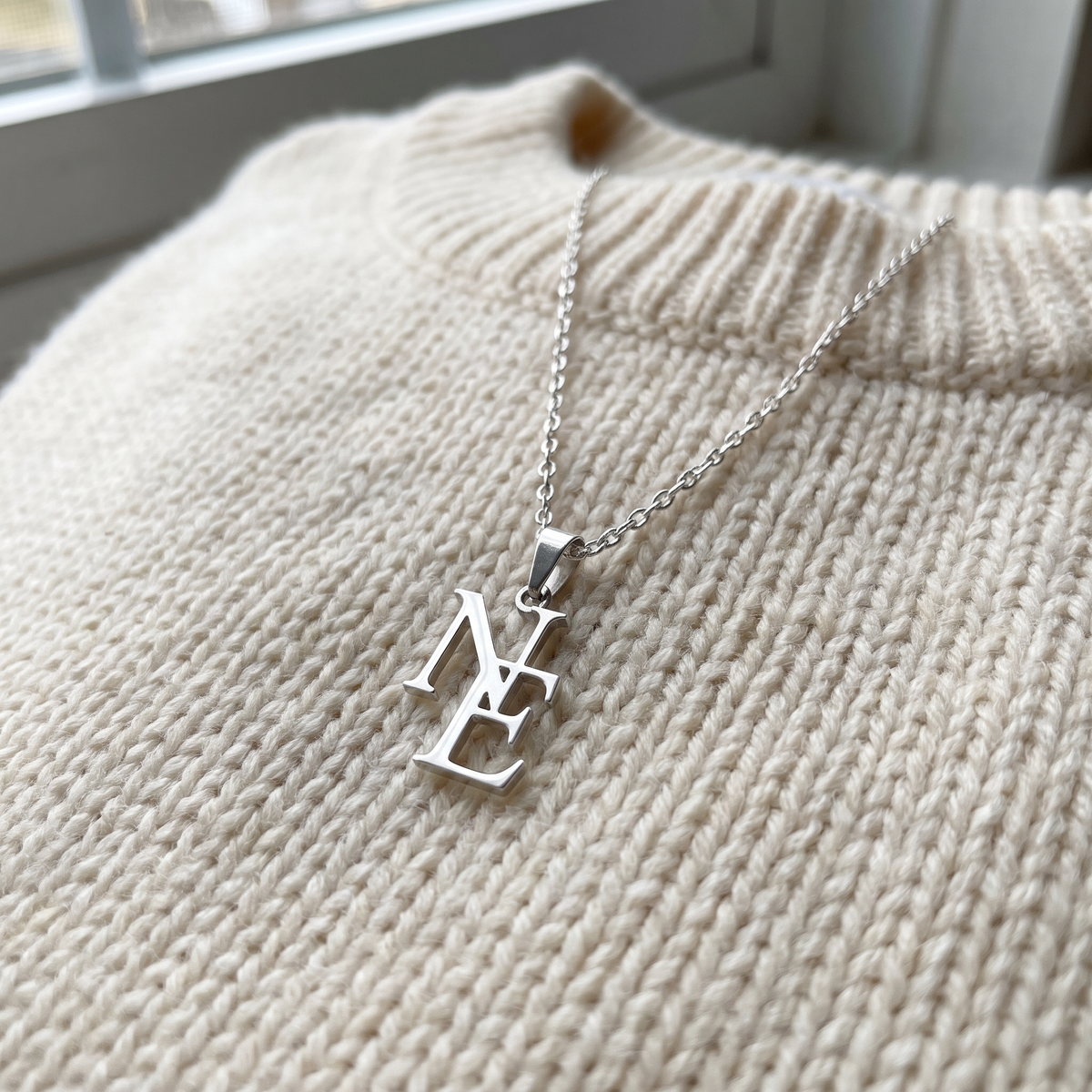 LUVED initials necklace silver close-up