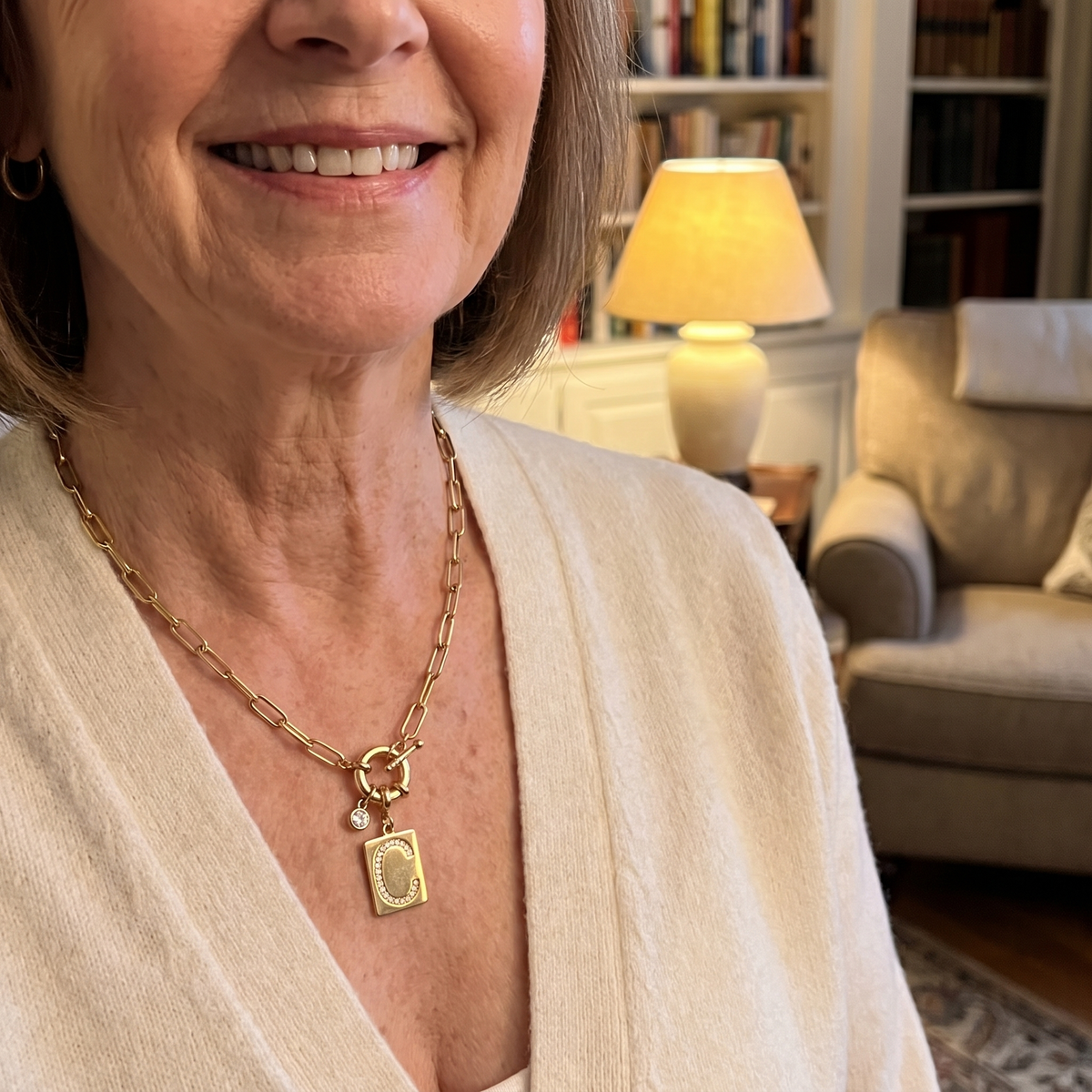 PAVE initial necklace worn at home